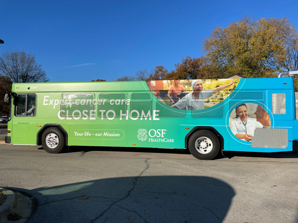 Danville Mass Transit Bus Decorated for OSF Cancer Center Driven by