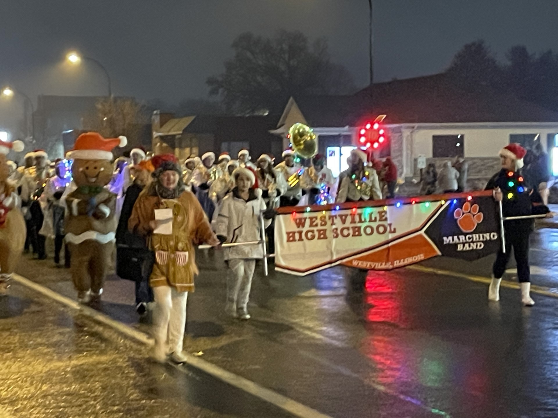 Solid, Cheerful Crowd at Night of Lights Parade Despite Rainy Weather ...